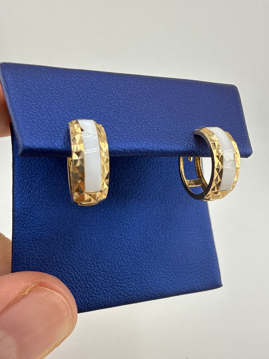 14k gold huggie earrings | two-toned striped and hammered design | open backing