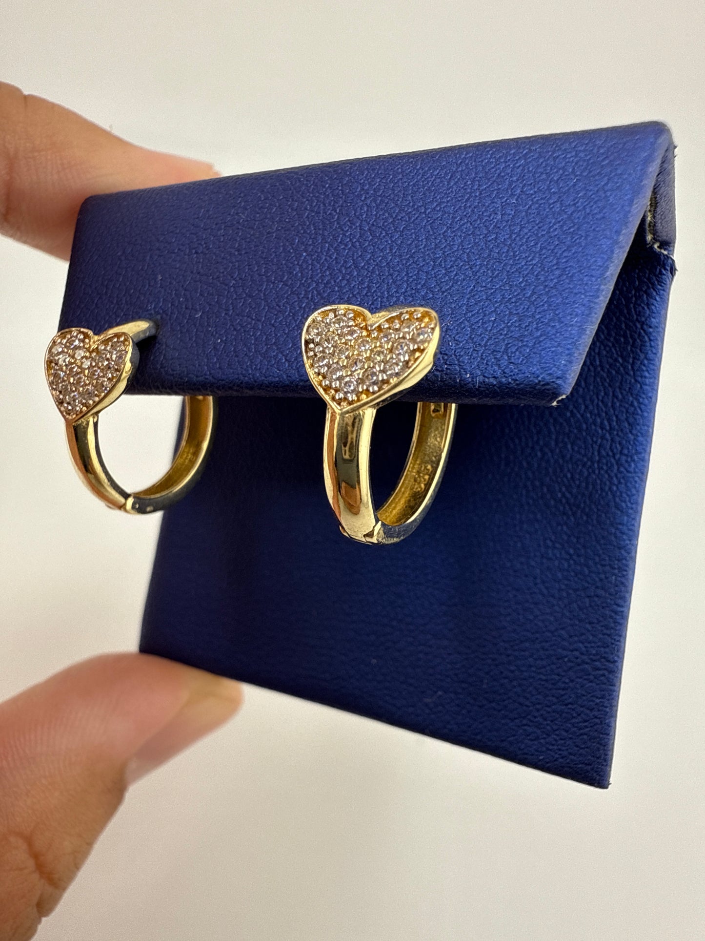 14k yellow and zirconia heart huggie earrings