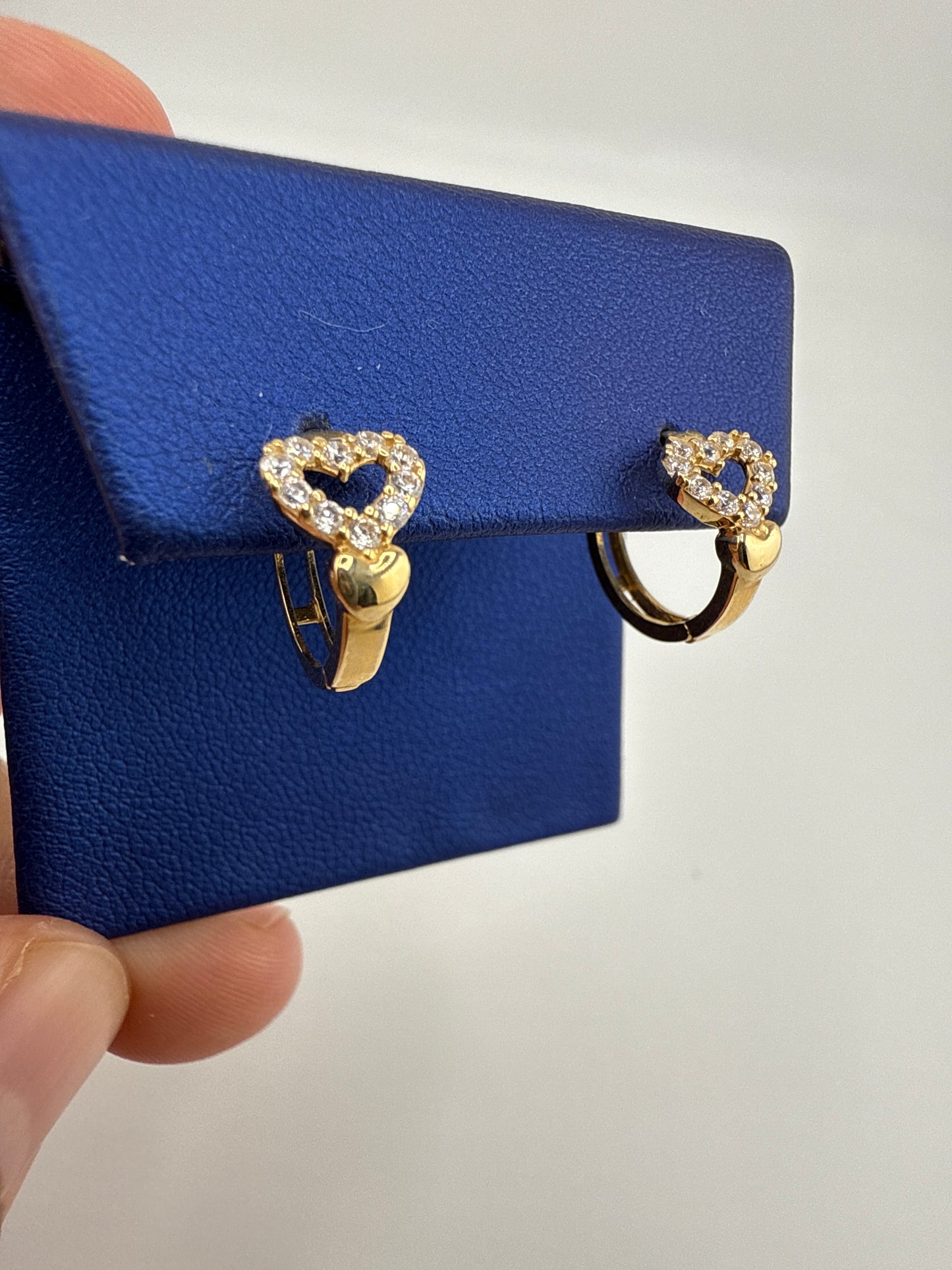 14k yellow and zirconia heart huggie earrings