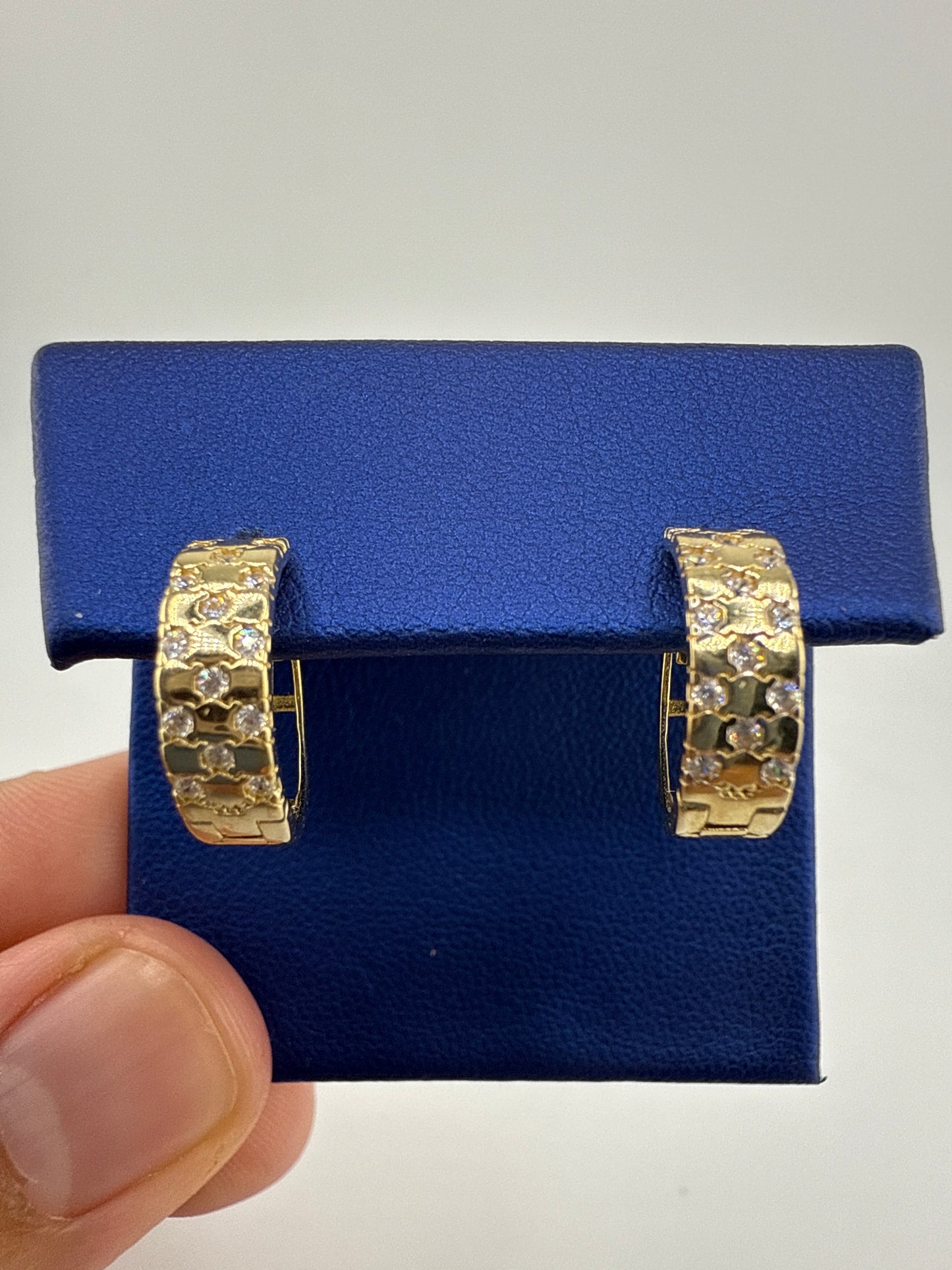 14k yellow gold and zirconia huggie earring checkered pattern
