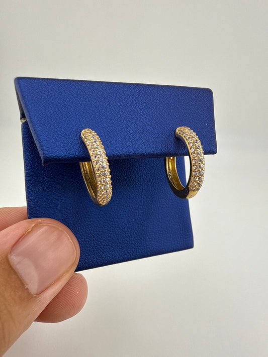 14k yellow gold huggie earrings with zirconia