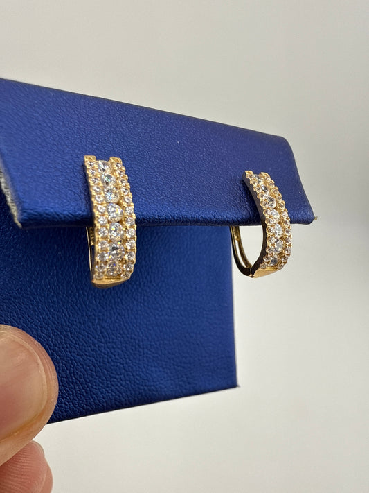 14k yellow gold huggie earrings with zirconia