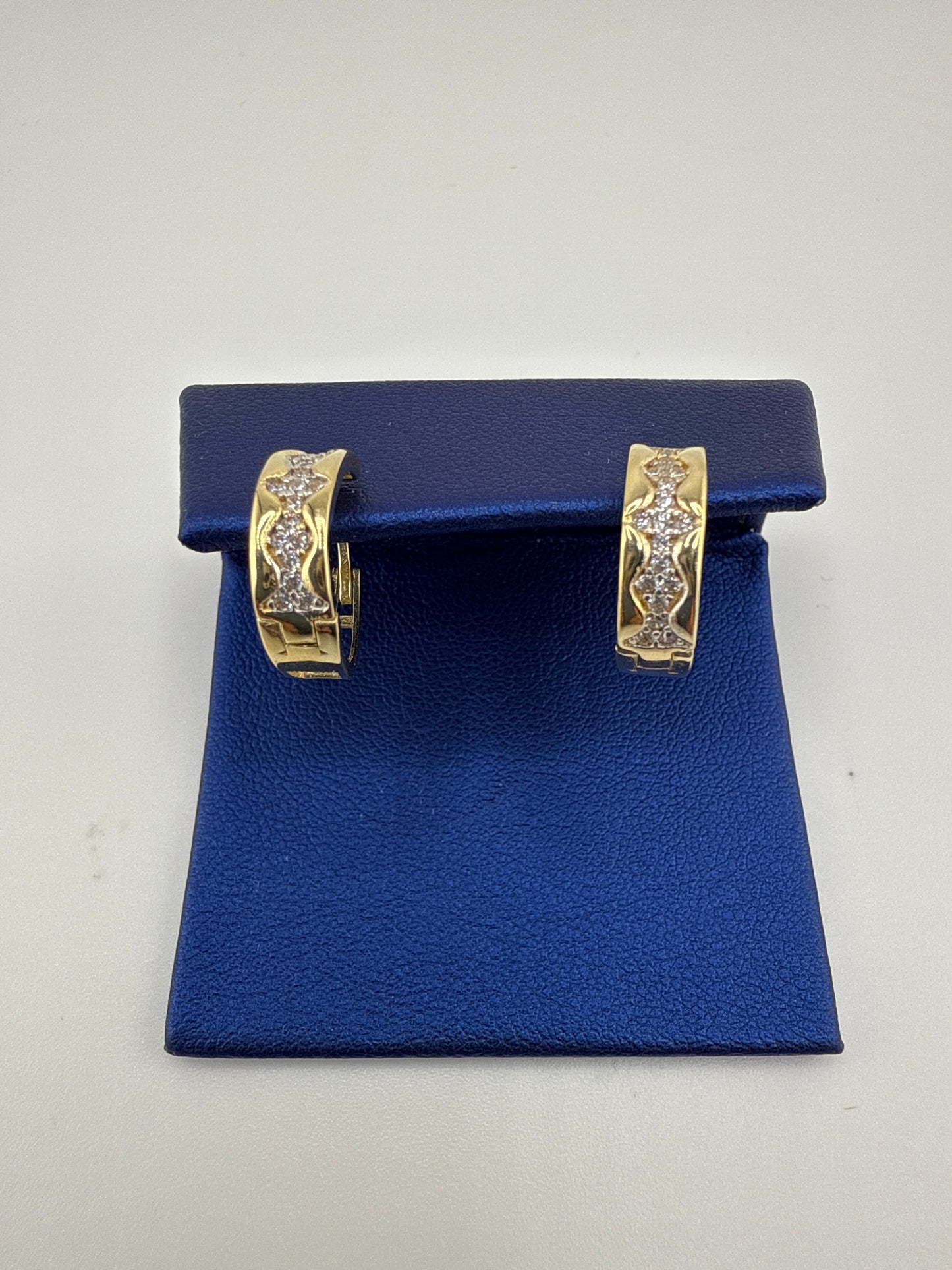 14k yellow gold and zirconia huggie earrings