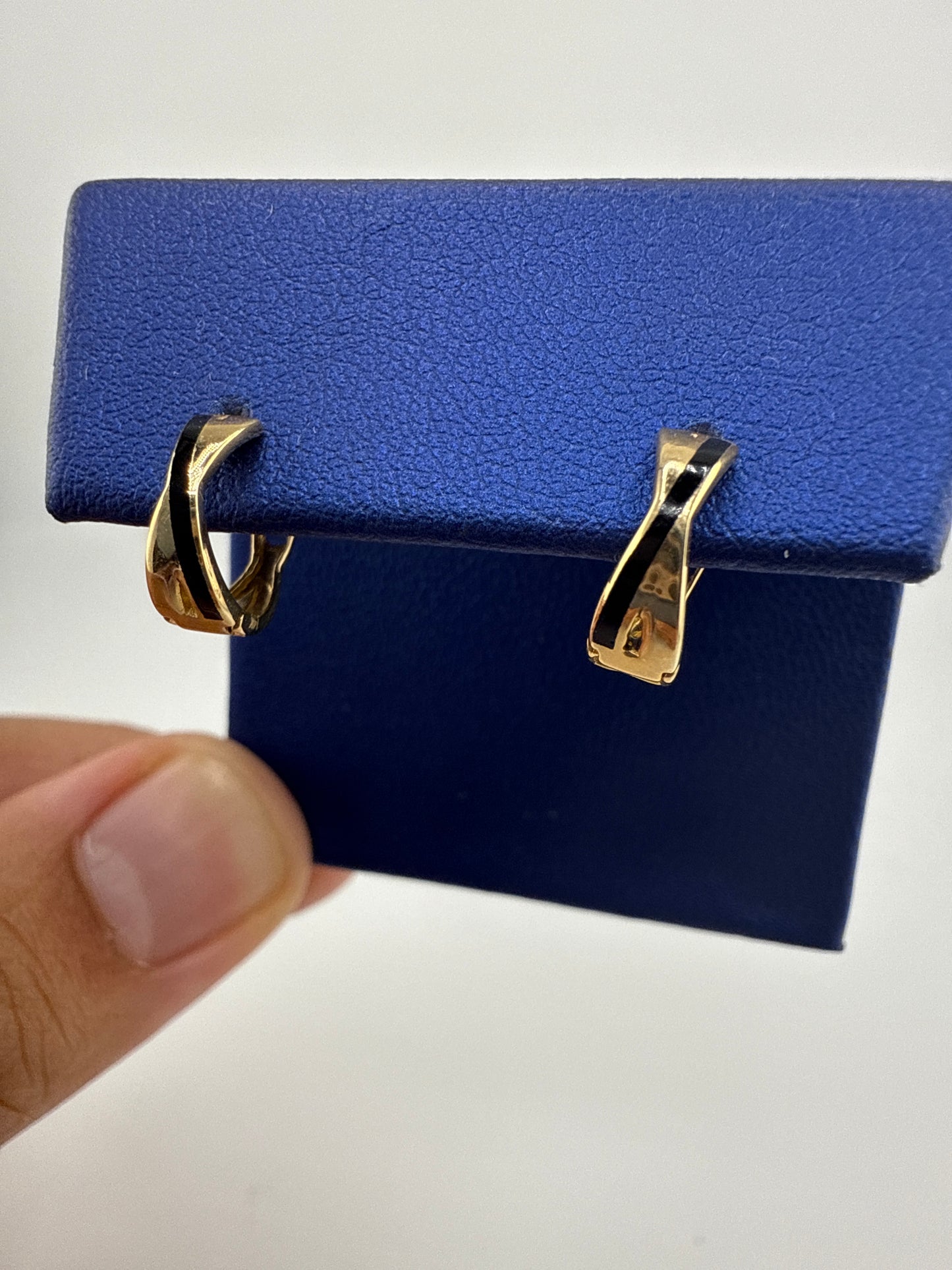 14k gold huggie earrings | black detail