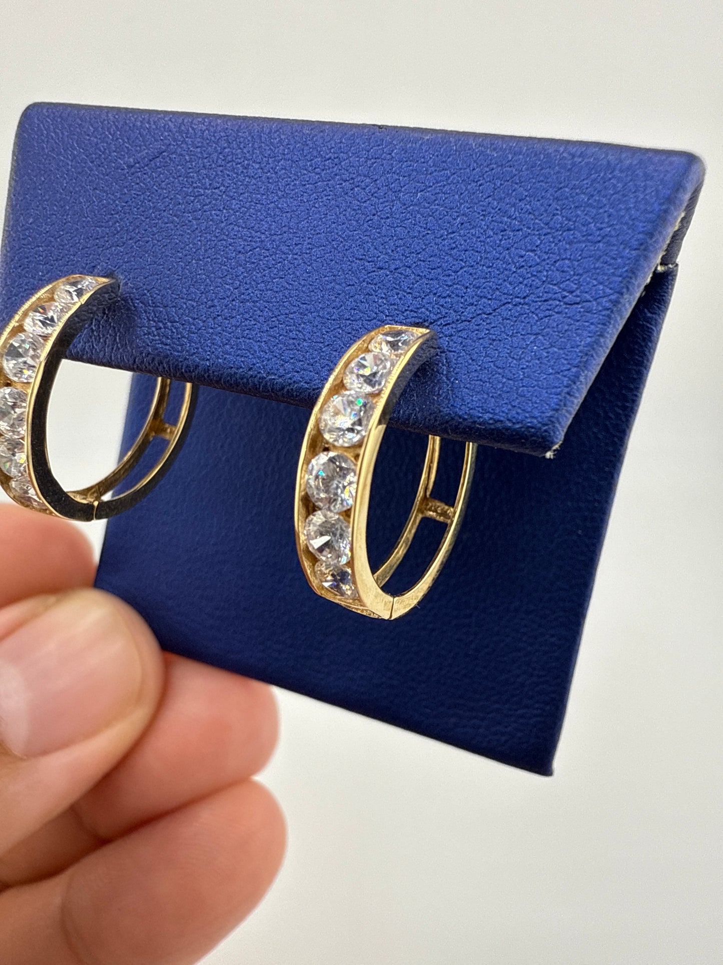 14k yellow gold and zirconia huggie earrings