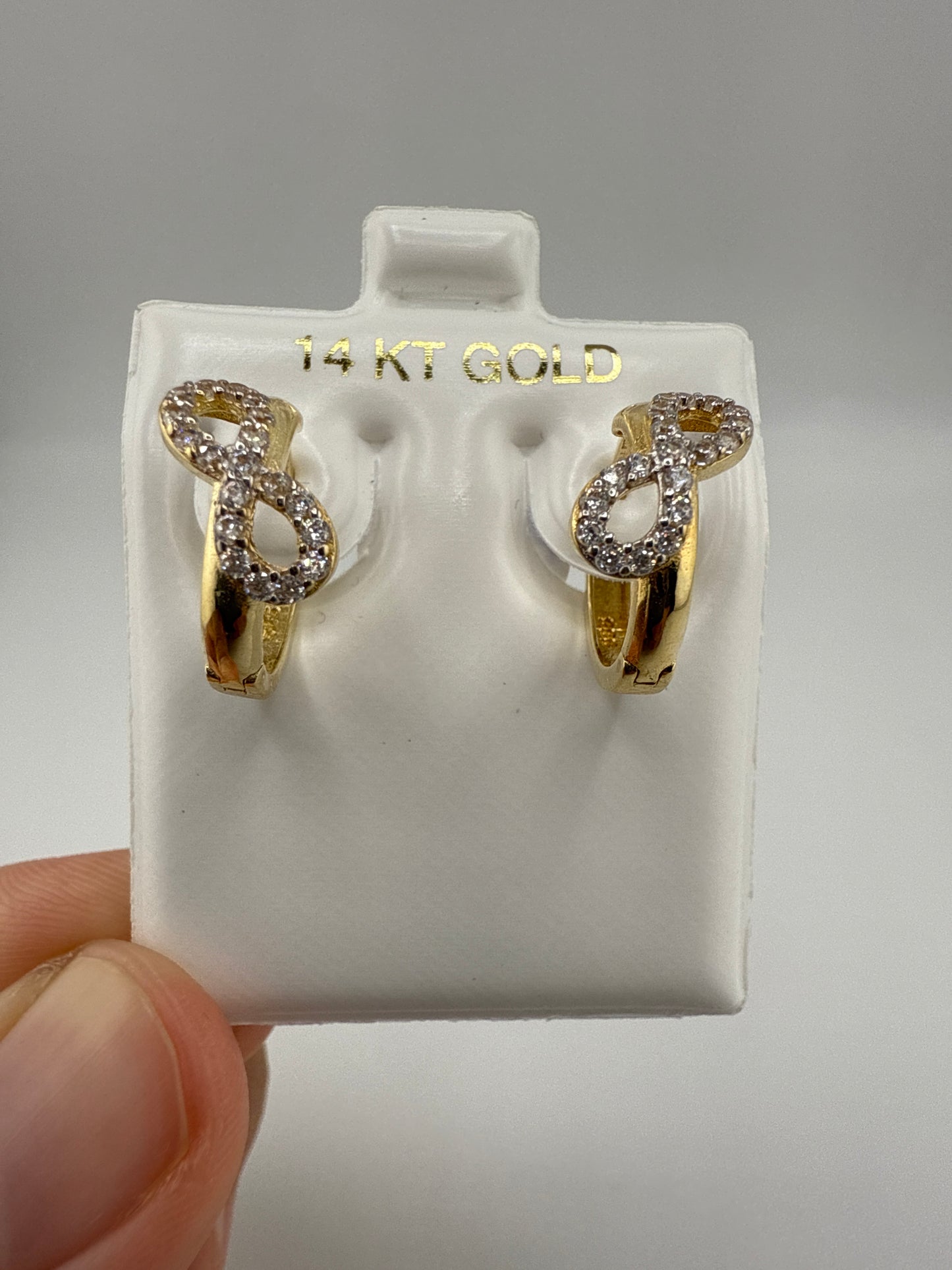 14k Yellow Gold and Zirconia Bow Huggie Earrings