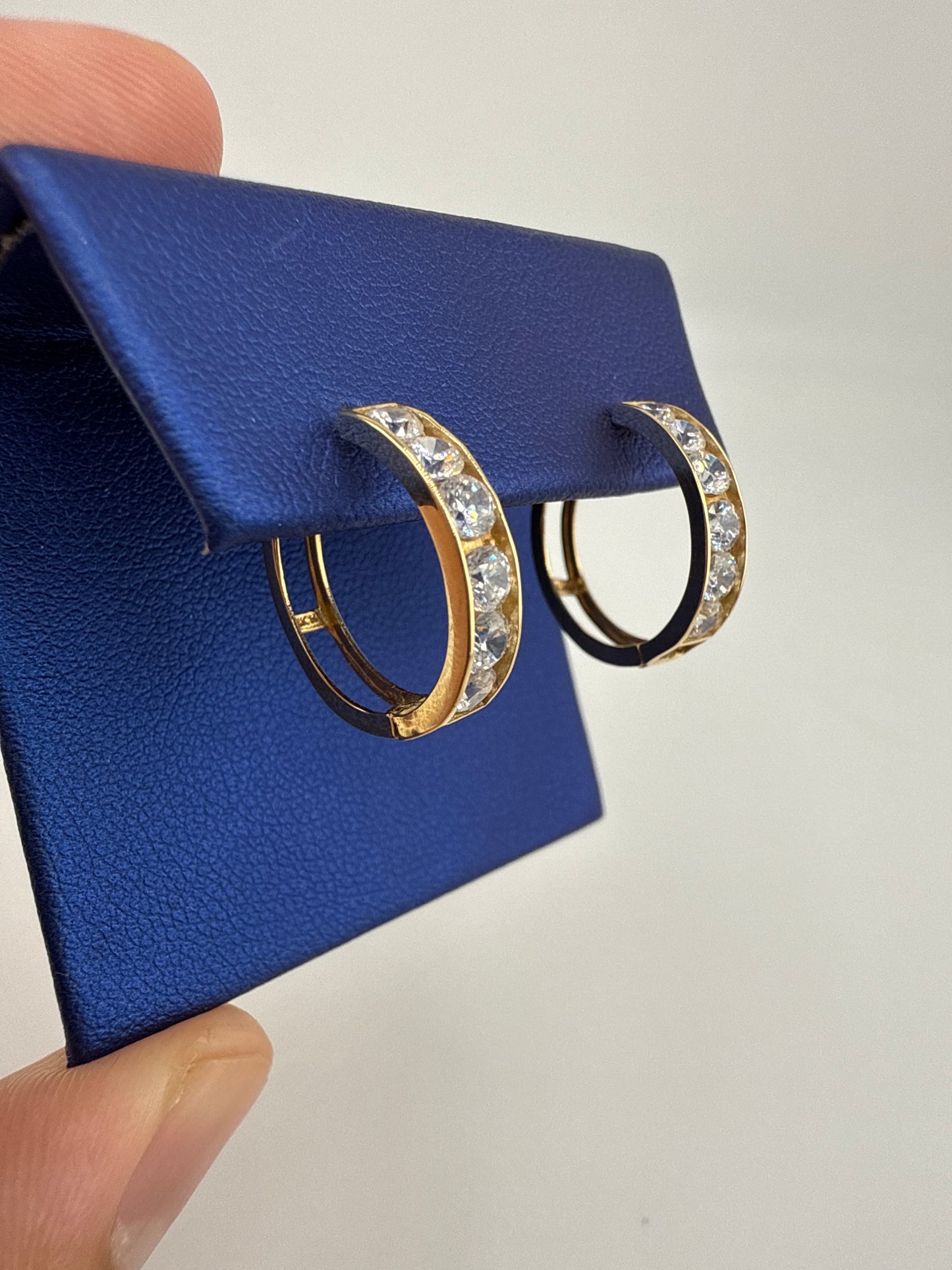 14k yellow gold and zirconia huggie earrings