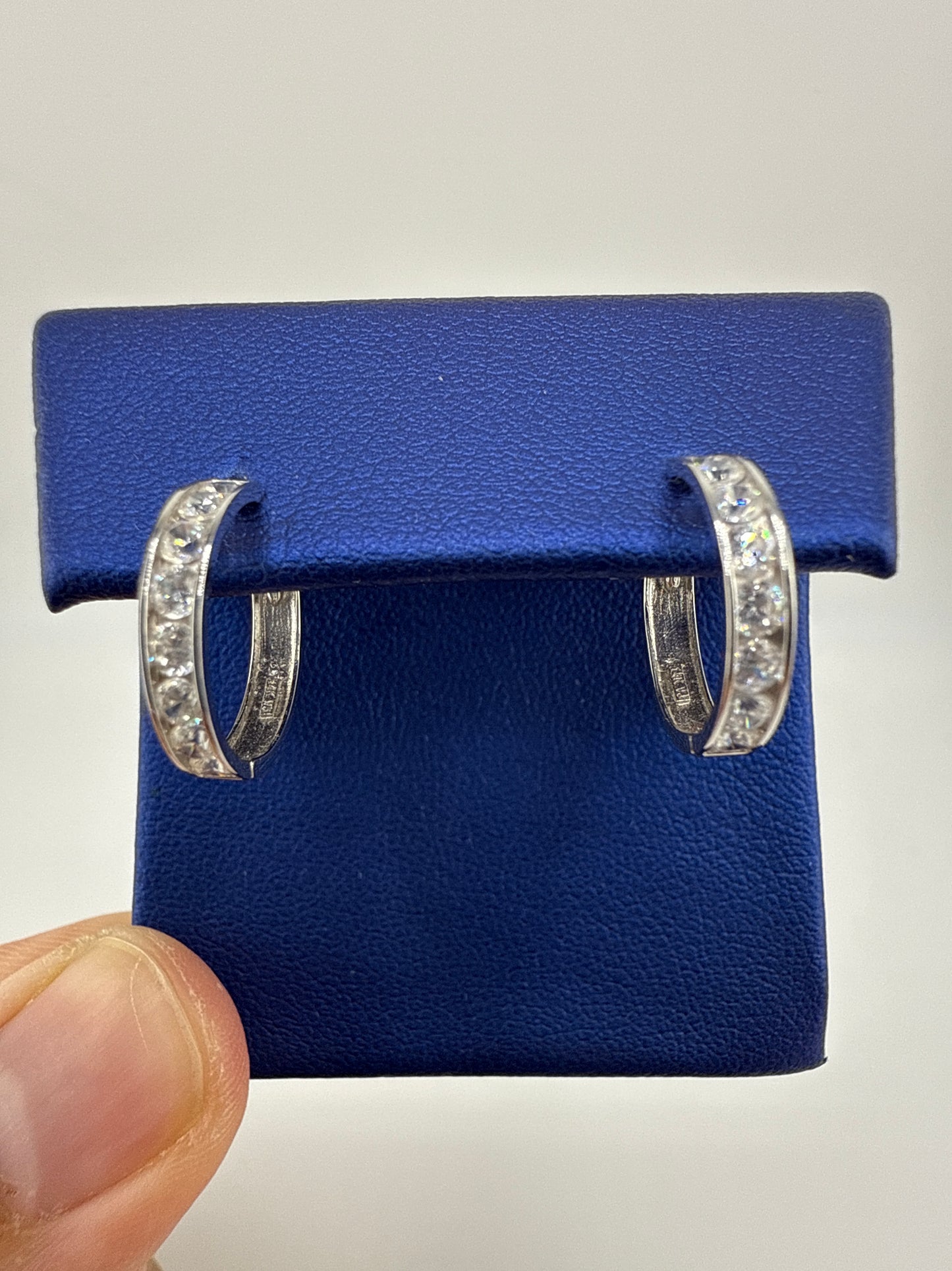 14k white gold huggie earrings with zirconia