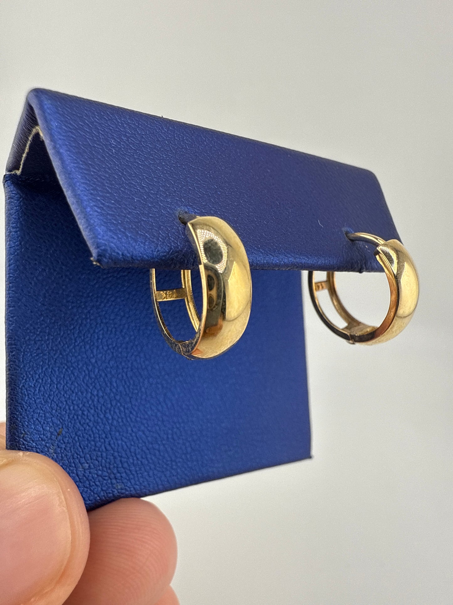 14k gold huggie earrings simple design and open backing