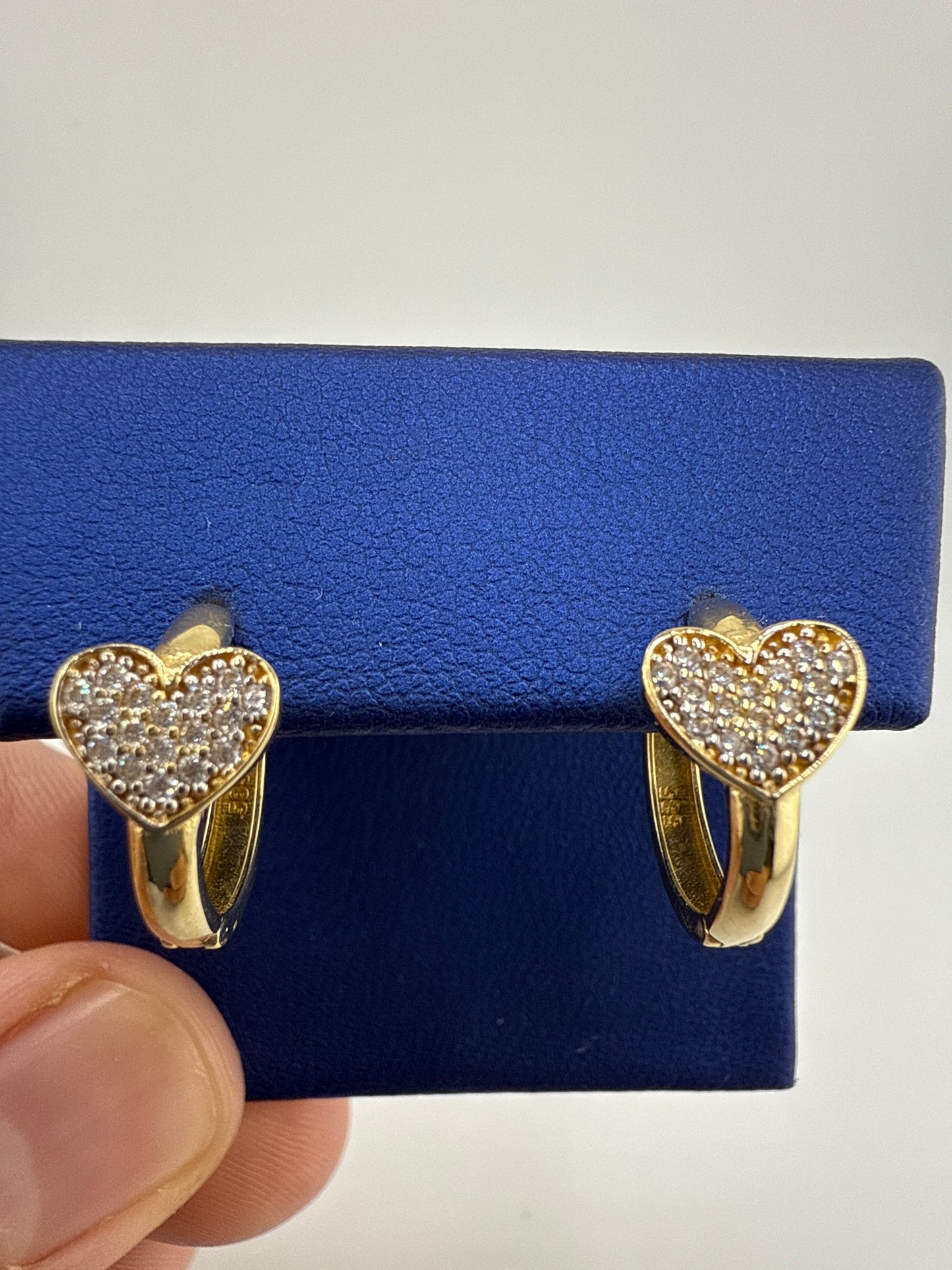 14k yellow and zirconia heart huggie earrings