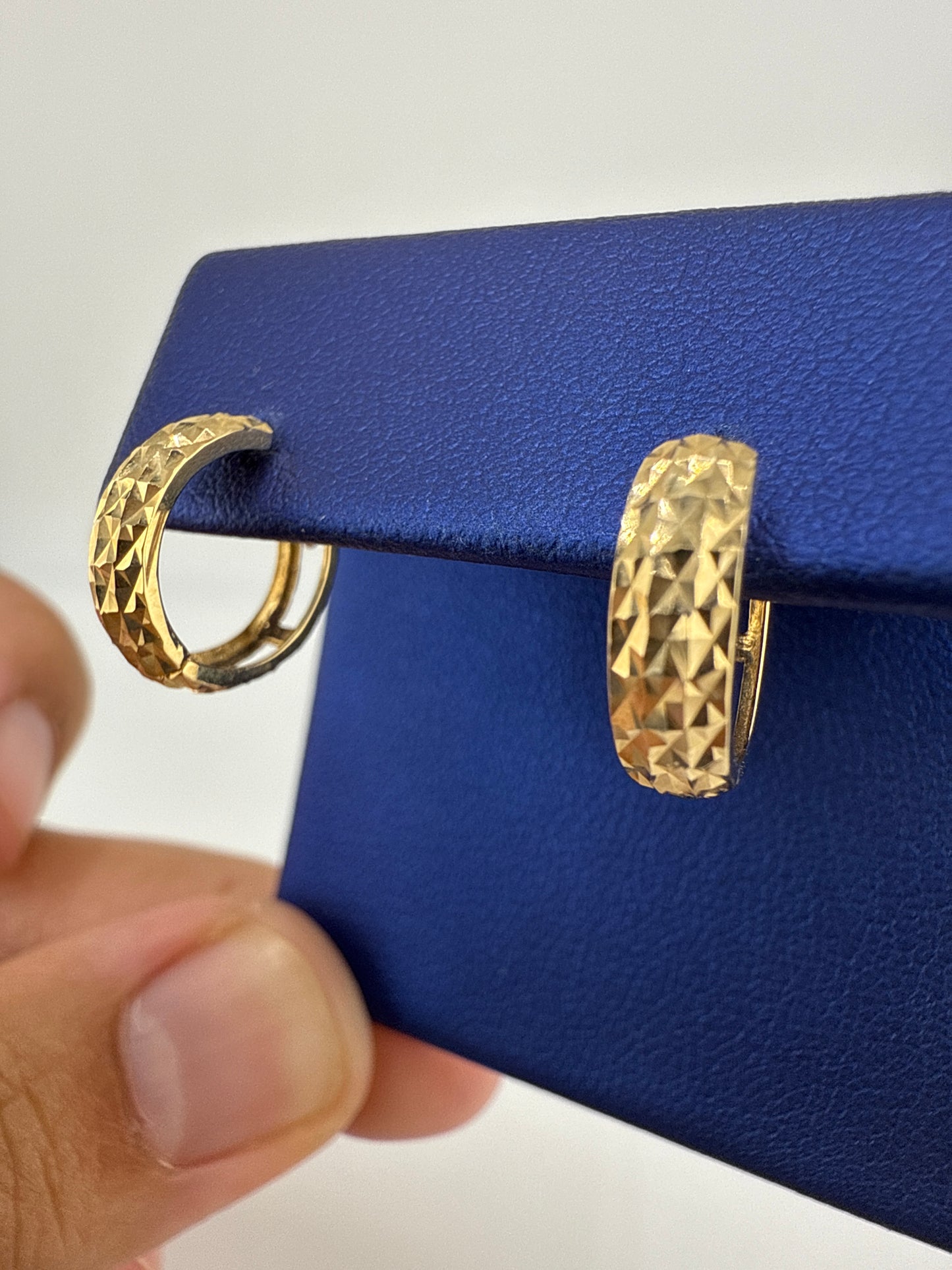 14k gold huggie earrings | hammered pattern design | open backing