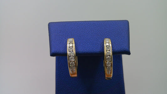 14k yellow gold diamond huggie earrings | .21 carat