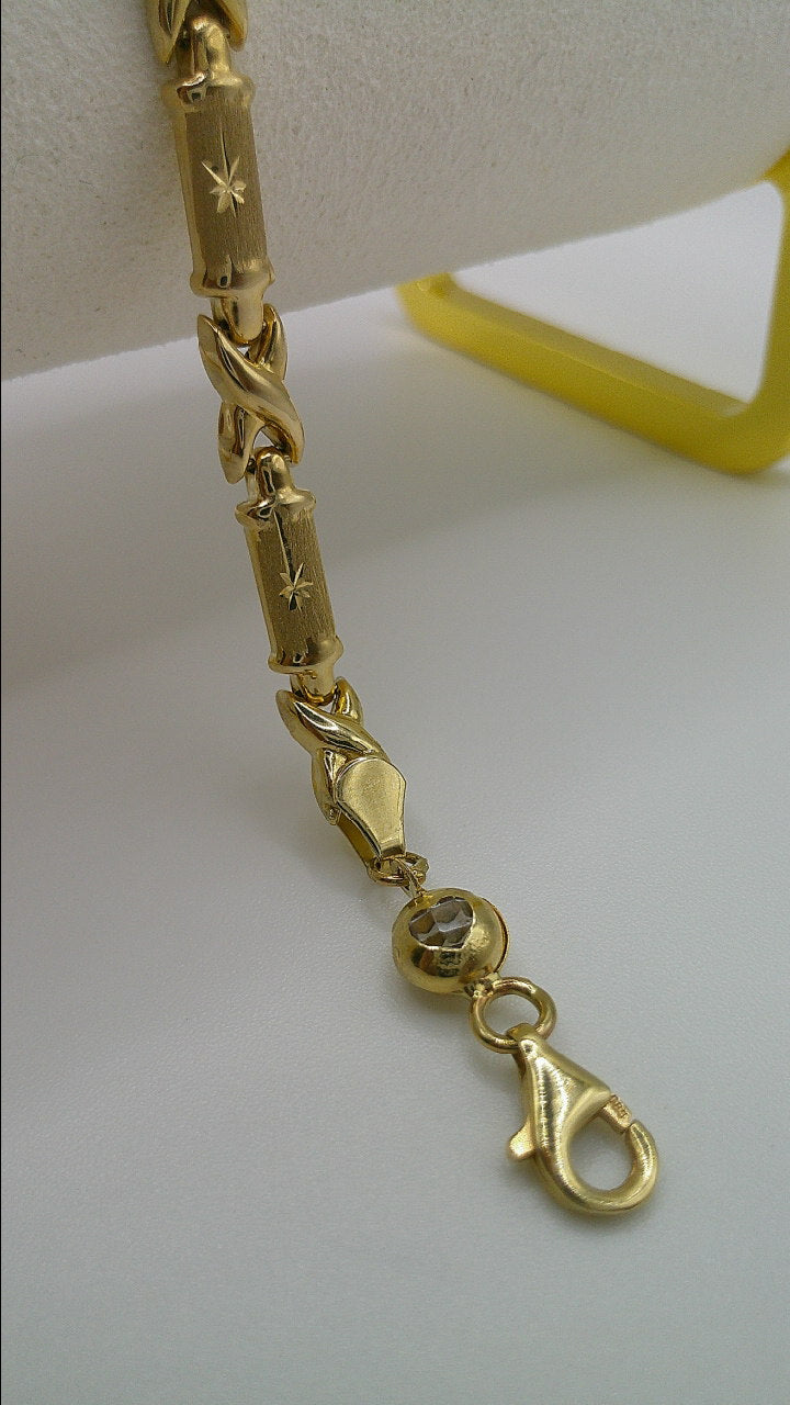 14k gold XO bracelet | star center design | 7.25 inches