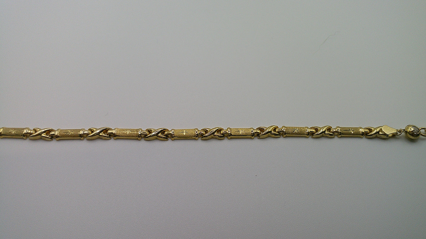 14k gold XO bracelet | star center design | 7.25 inches