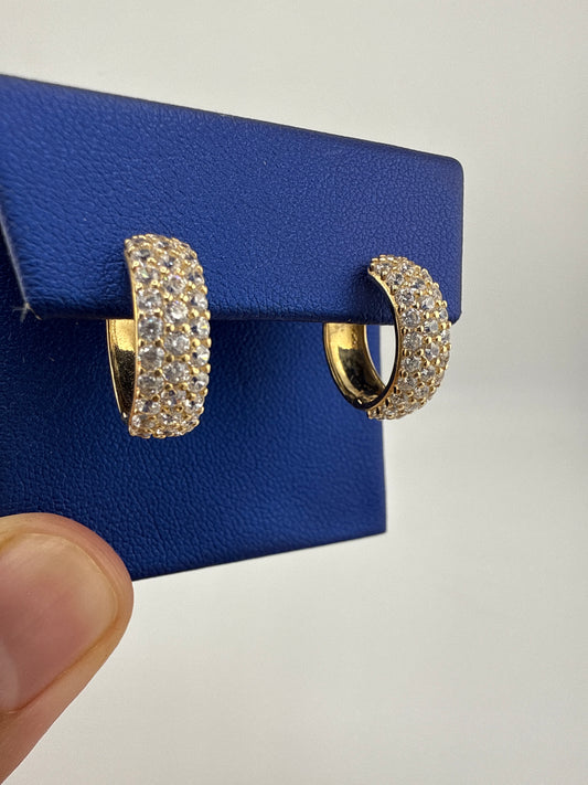 14k yellow gold and zirconia huggie earrings
