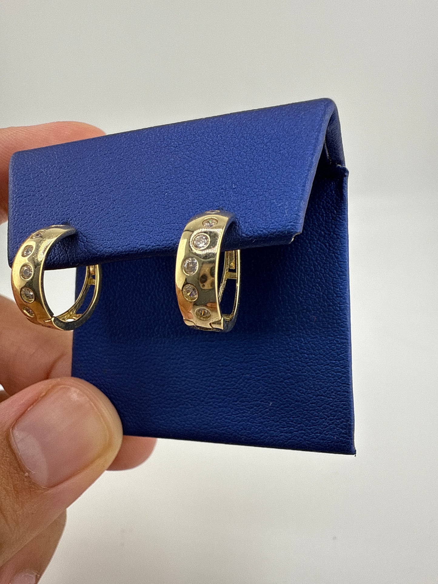 14k gold huggie earrings | zirconia | open backing