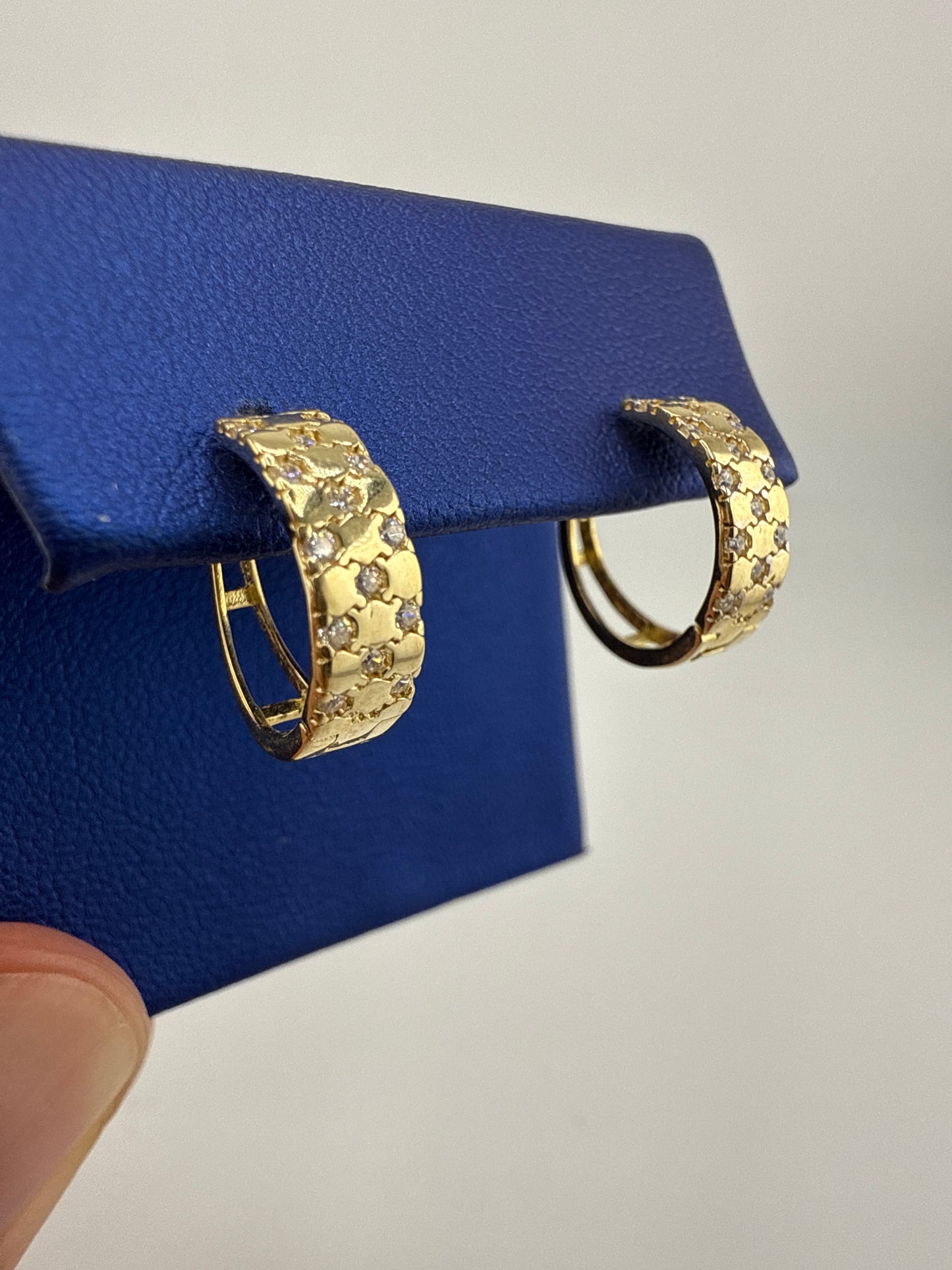 14k yellow gold and zirconia huggie earring checkered pattern