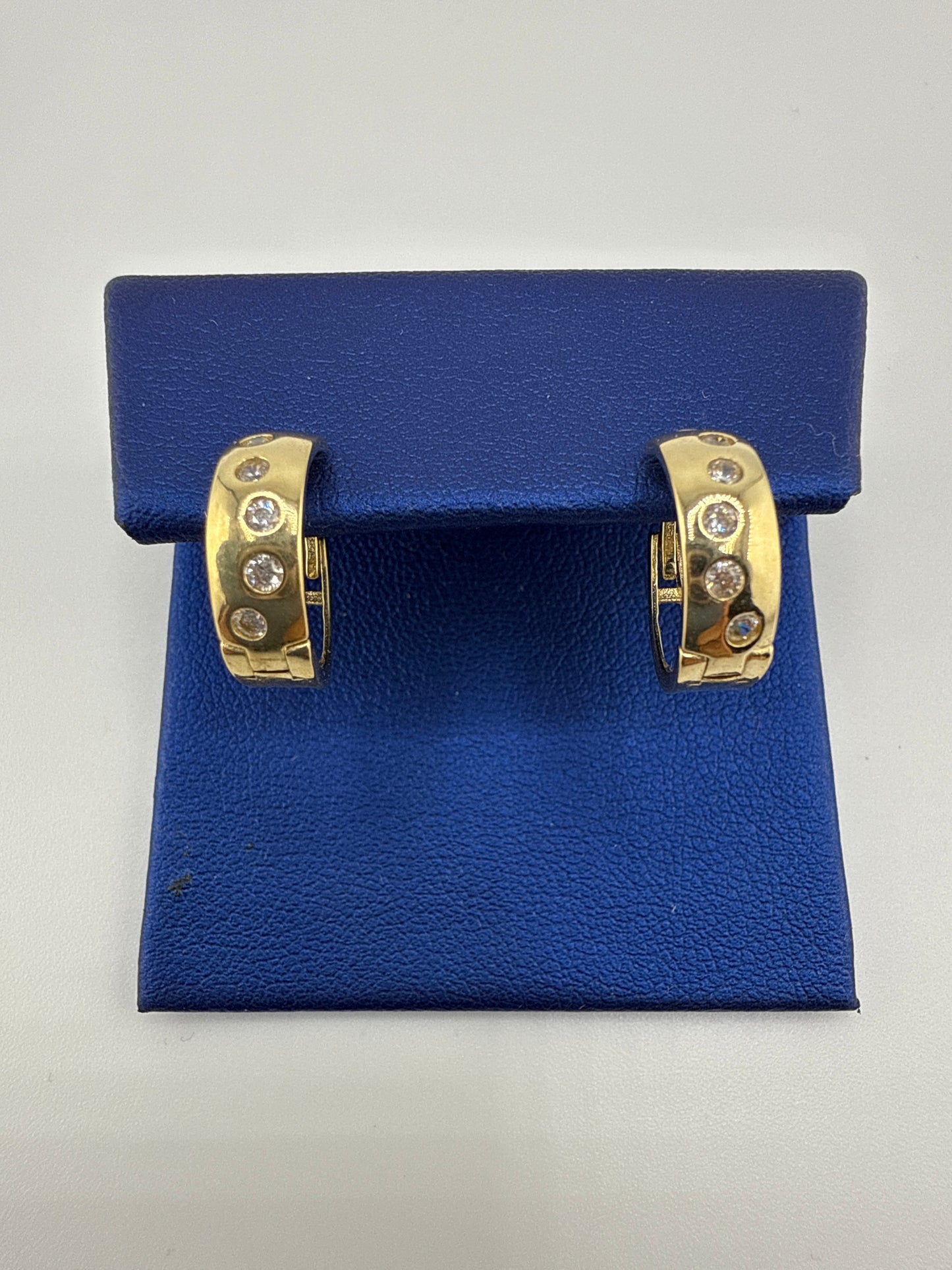 14k gold huggie earrings | zirconia | open backing