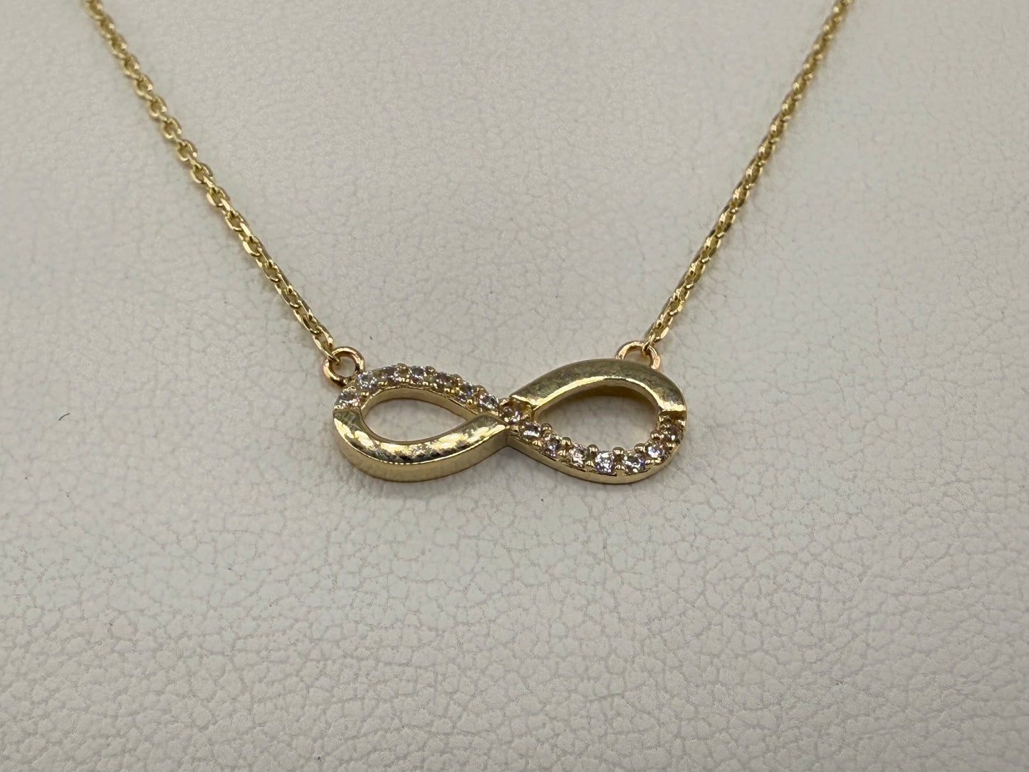 14k gold infinity pendant with zirconia and chain
