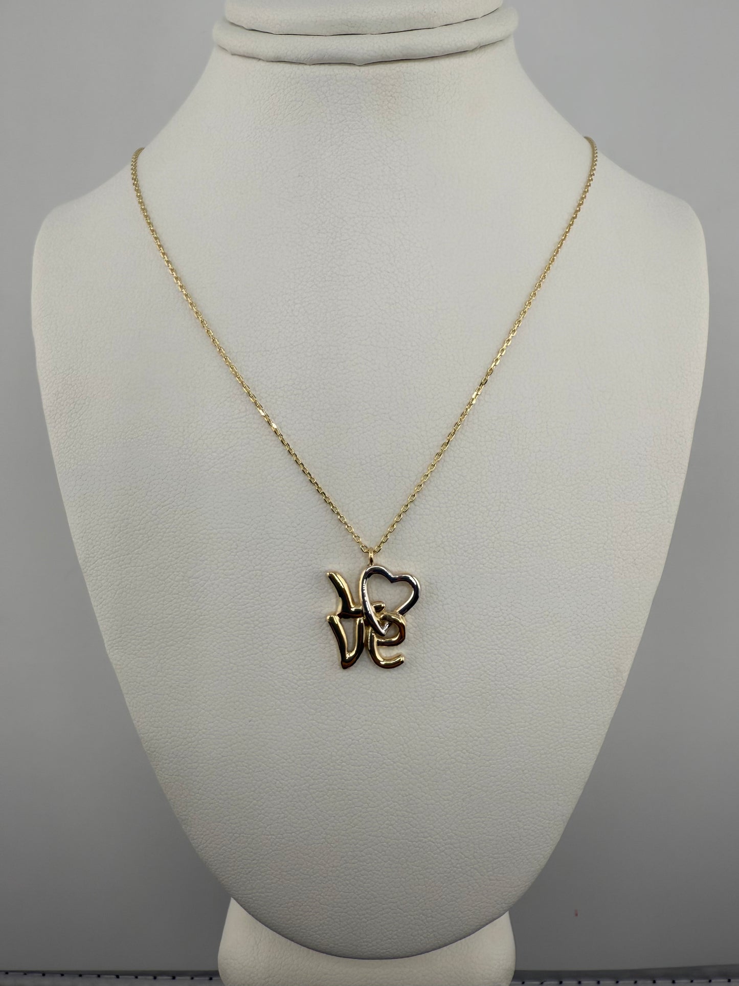 14k two-toned gold “Love” pendant | yellow and white gold