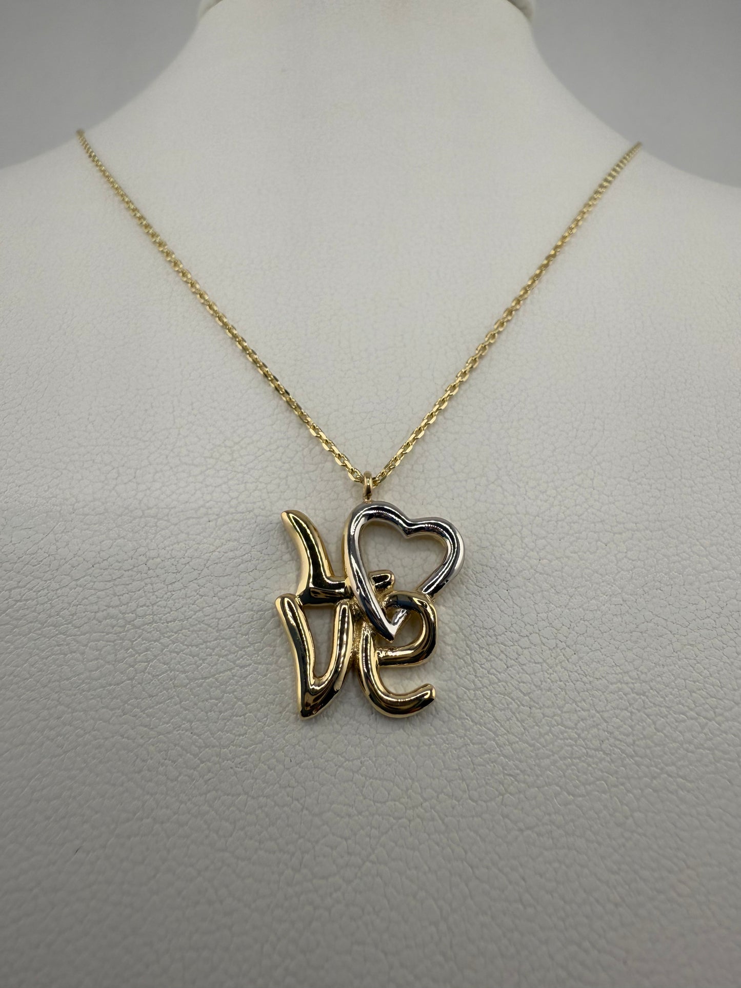 14k two-toned gold “Love” pendant | yellow and white gold