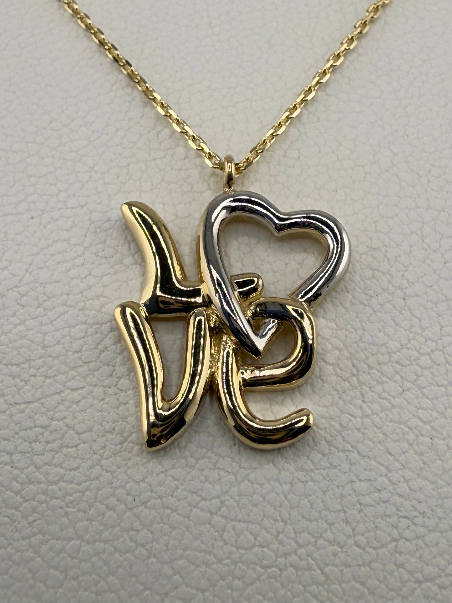 14k two-toned gold “Love” pendant | yellow and white gold