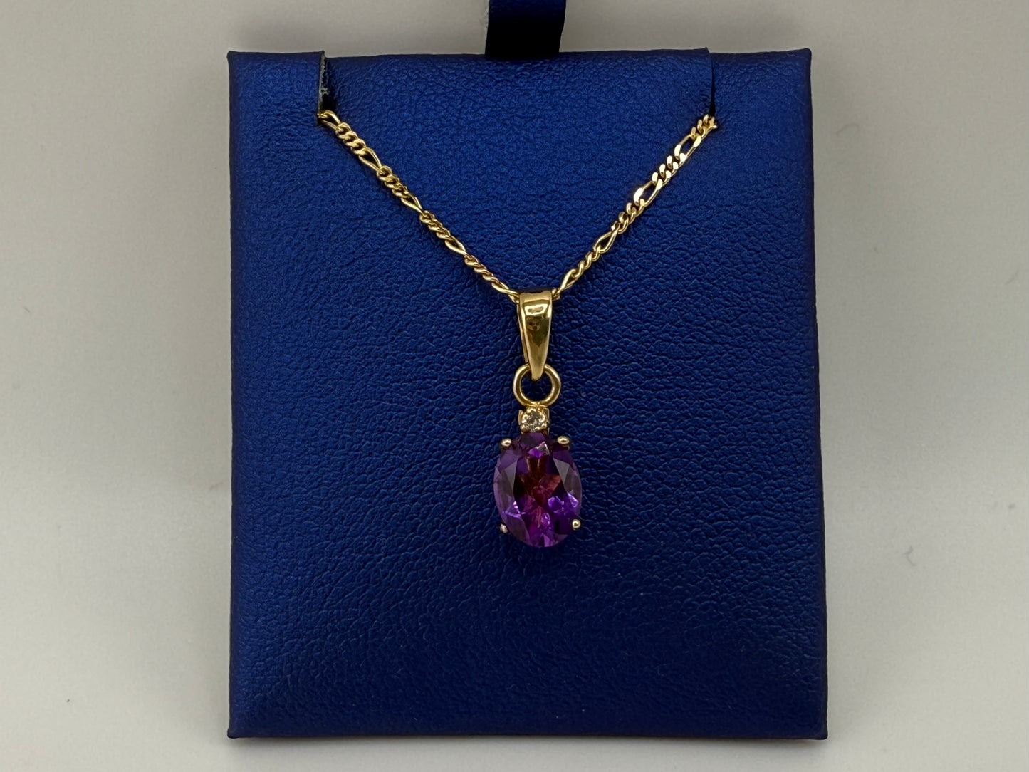 14k yellow gold figaro & Cuban link combination chain with purple gemstone pendant