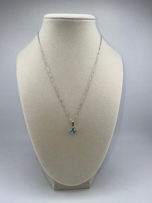 14k white gold chain and light blue gemstone pendant