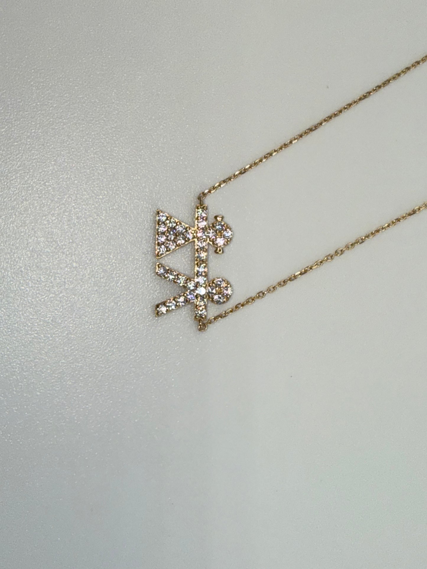 14k yellow gold with zirconia pendant with boy and girl symbol