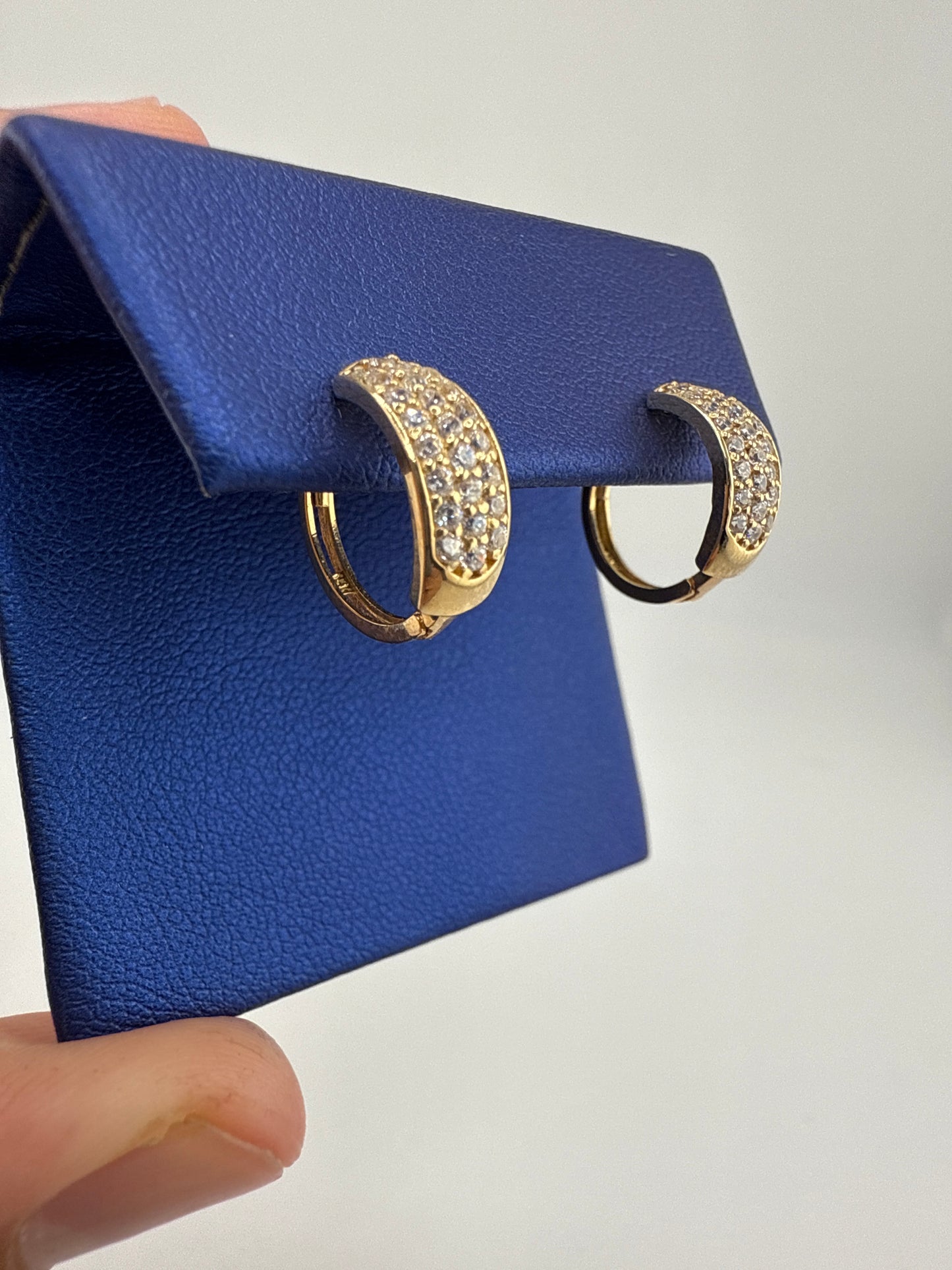 14k yellow gold and zirconia huggie earrings