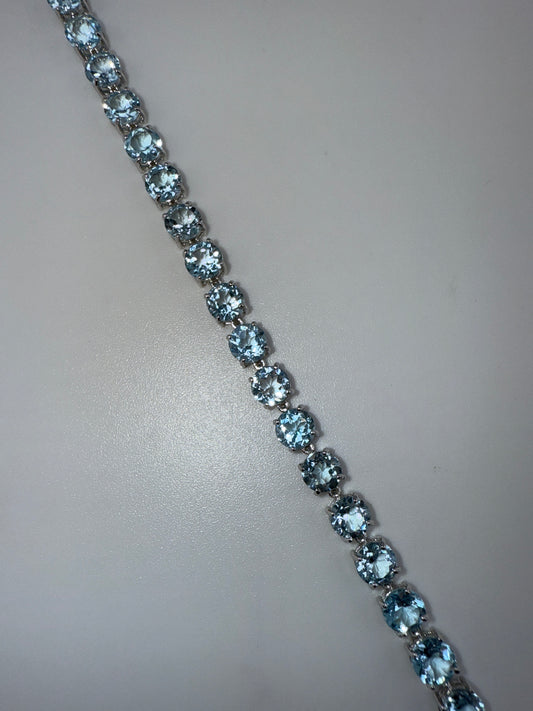 Sterling Silver, Four-Prong Blue Topaz Bracelet