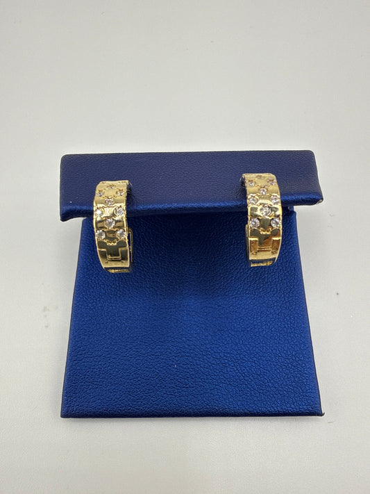 14k yellow gold and zirconia huggie earring checkered pattern