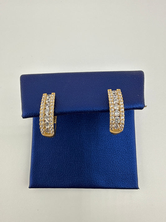 14k yellow gold huggie earrings with zirconia