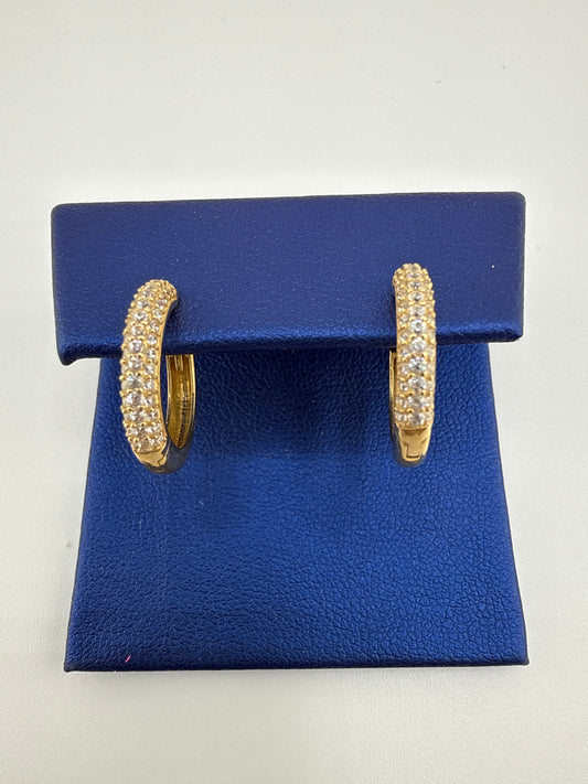 14k yellow gold huggie earrings with zirconia