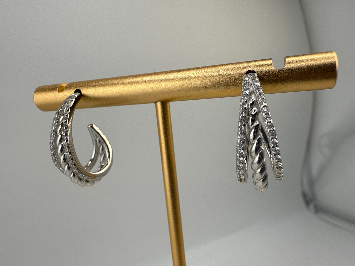 Sterling Silver Triple Row Zirconia and Twist Design Half Hoop Earrings