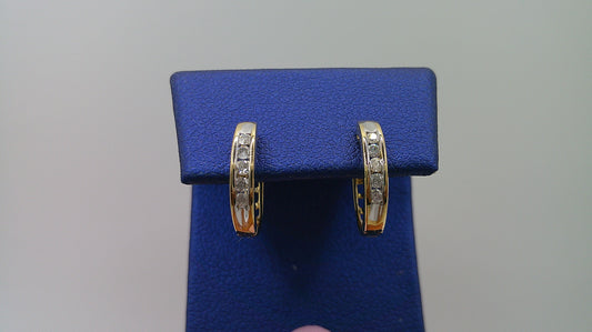 14k yellow gold diamond huggie earrings | .15 carat