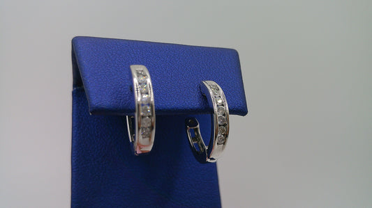 14k white gold diamond huggie earrings | .23 carat