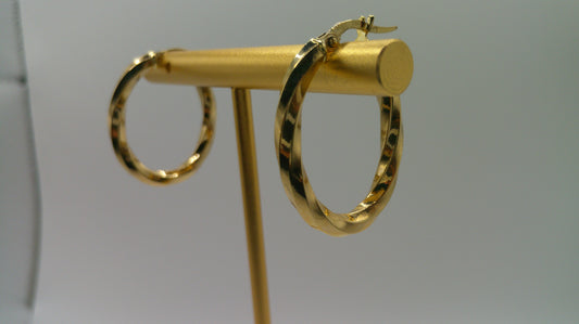 14k yellow gold | oval shiny twist hoop