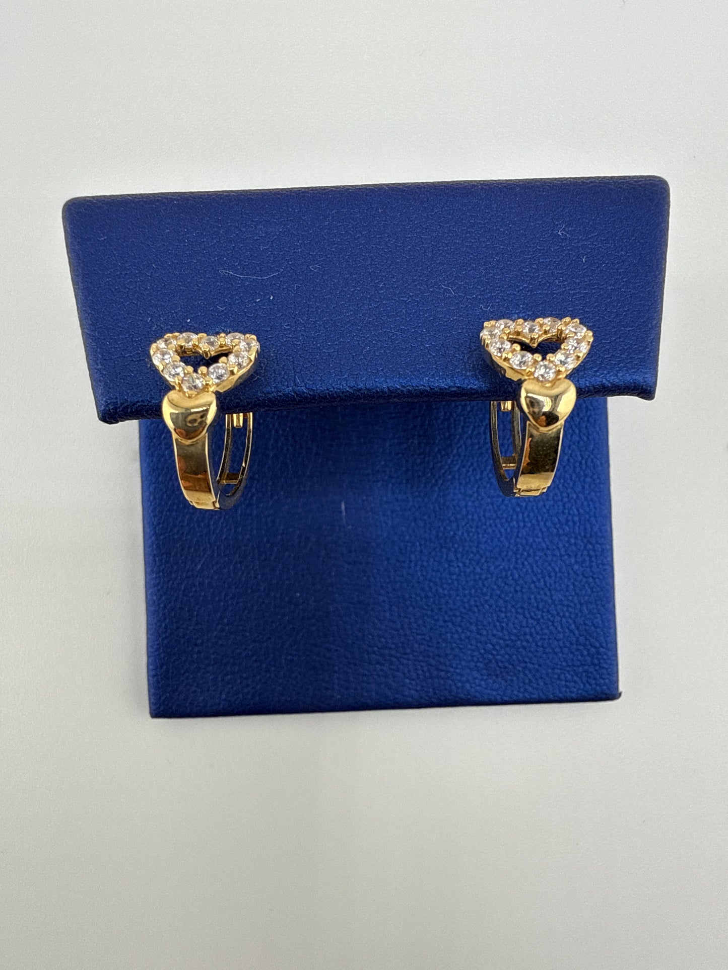14k yellow and zirconia heart huggie earrings